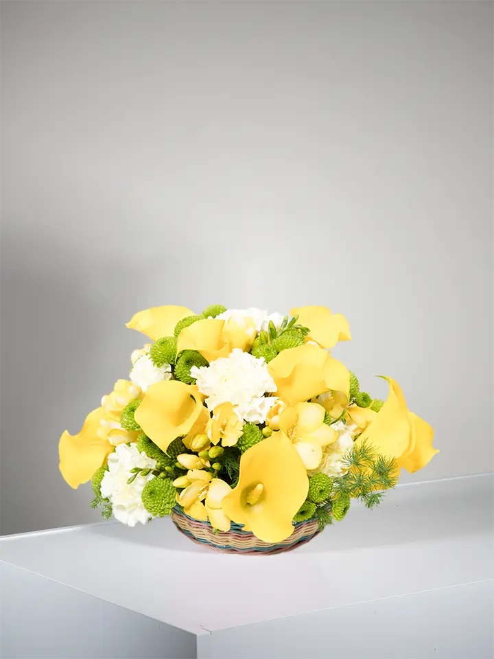 Centerpiece of Yellow Calla Lilies and Freesia