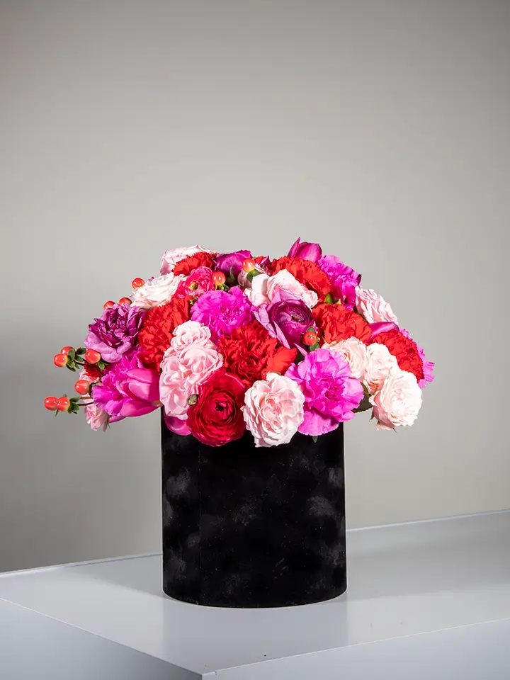 Flower box of red, fuchsia and pink flowers