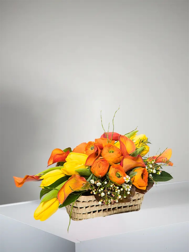 Basket of orange and yellow flowers