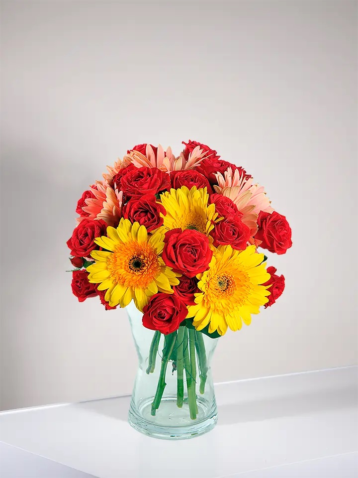 Bouquet of yellow Gerbs and red Roses