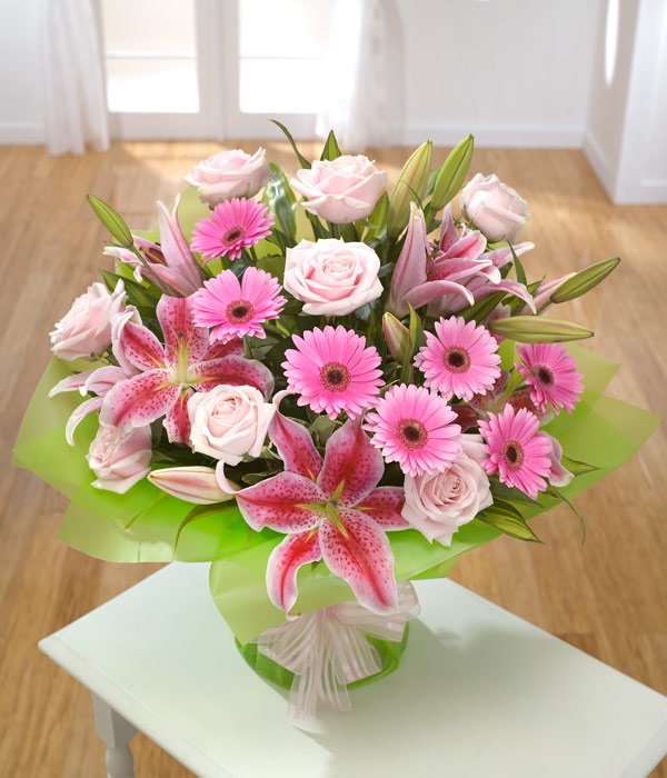 Hand tied bouquet of pink flowers 